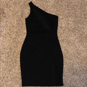 Never worn! Black dress, slit on skirt and front.